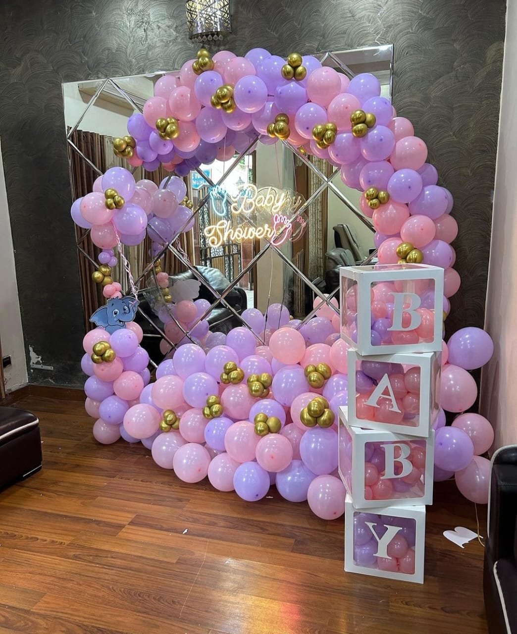 Pastel pink and lavender baby shower balloon decoration with BABY blocks